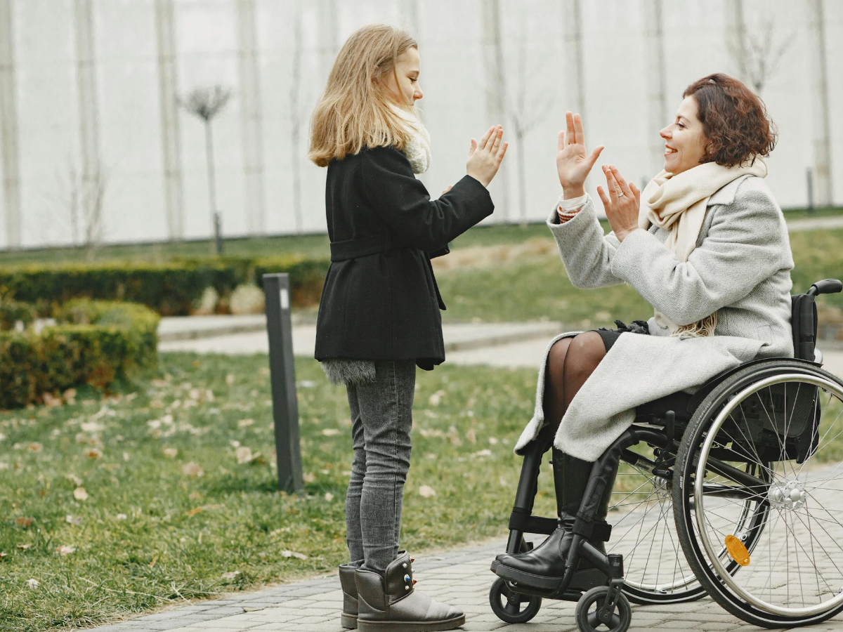 A Dotty's Care support worker laughing with a participant